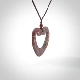Hand carved Red Jasper Stone contemporary heart pendant. Carved by NZ Pacific in Jasper Stone. This is a heart drop pendant made from natural materials.